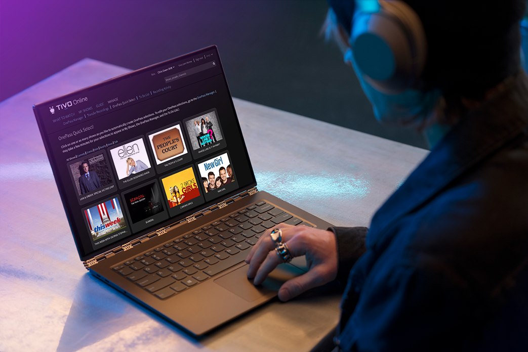 Image of laptop with man wearing headphones looking at TiVo Online