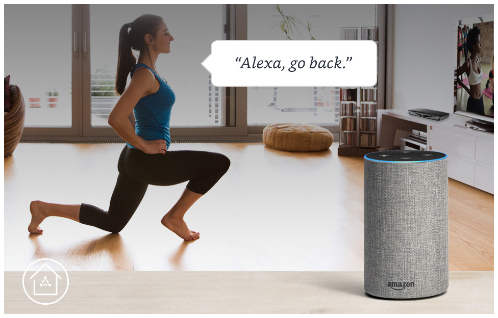 woman doingh yoga in her living room while commanding alexa